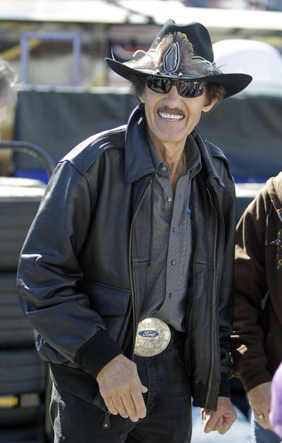 Car owner and former NASCAR driver Richard Petty visit the garages during practice. (Associated Press)