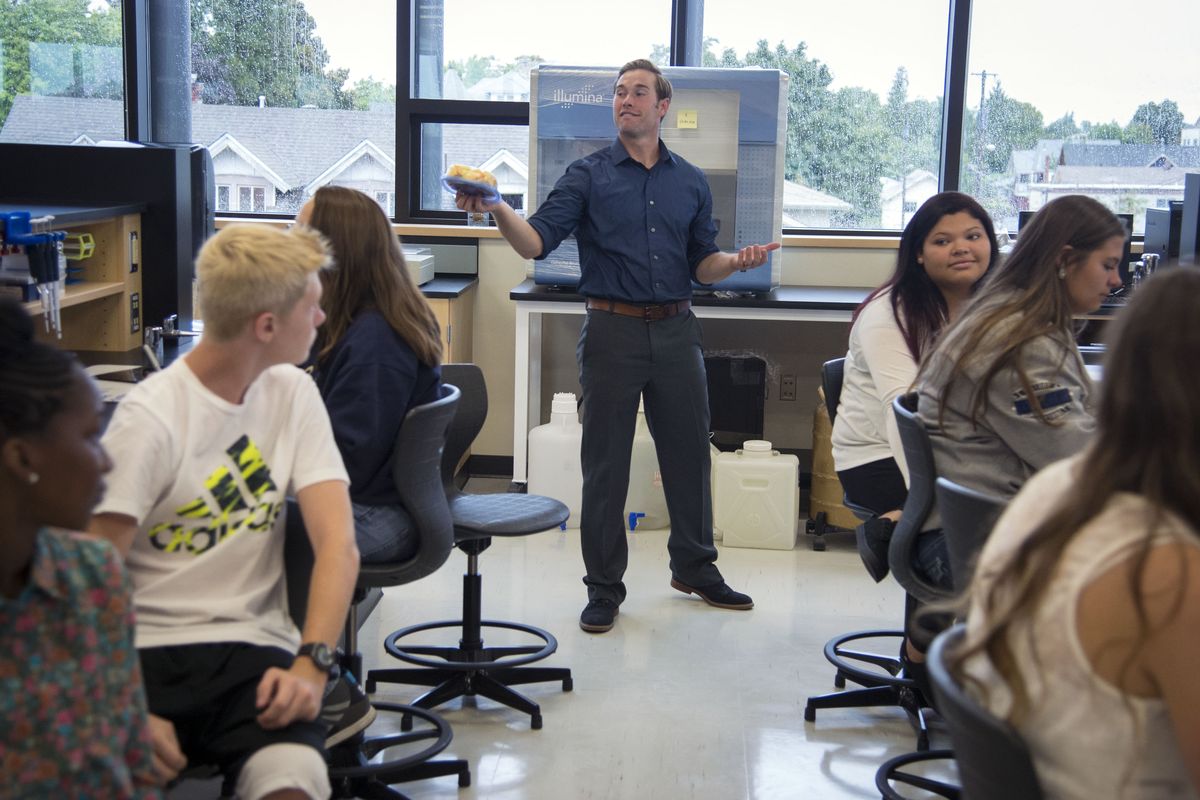 During the first day of class Wednesday at North Central High School’s new Institute of Science and Technology, biomedical technology teacher Shane Thomas preps students on the lab procedures to determine how much water is in different fruits and vegetables. Students now have access to doctoral-level science equipment in the state-of-the-art building. (Colin Mulvany)