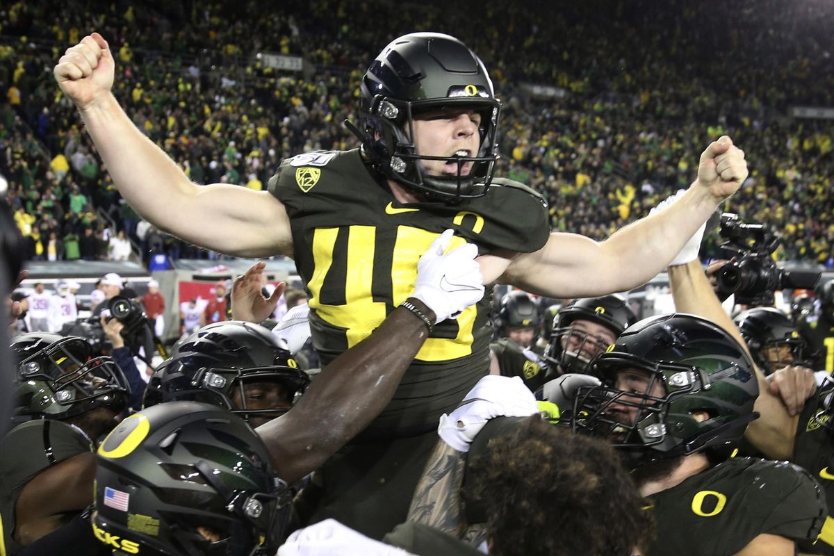 Oregon kicker Camden Lewis is carried off the field by his teammates after kicking the winning field goal against Washington State in an NCAA college football game Saturday, Oct. 26, 2019, in Eugene, Ore. (Chris Pietsch / AP)