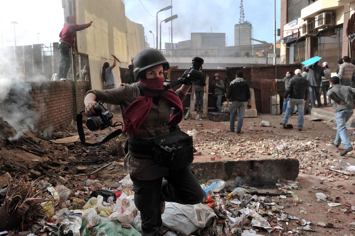 Former Spokesman-Review photojournalist Holly Pickett is pictured on the job in Cairo in 2011.