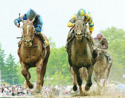 
Curlin and jockey Robby Albarado, left, passes Street Sense and jockey Calvin Borel to win the 132nd running of the Preakness Stakes. 
 (Associated Press / The Spokesman-Review)