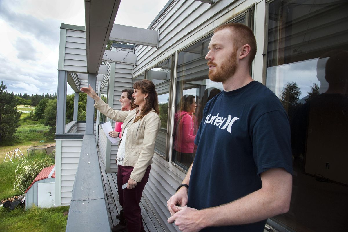 Emily Joselyn, left, and Kyle Hallett, right, get the grand tour from realtor Marianne Bornhoft as they visit a house on Basalt Street, June 10, 2016. The couple are hoping to move from the west side of Washington to the Spokane area. (Dan Pelle / The Spokesman-Review)