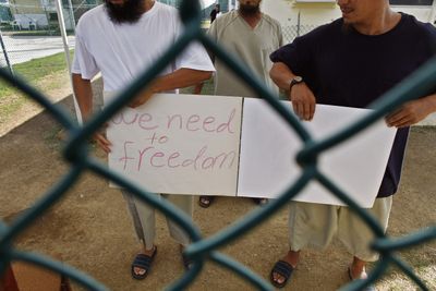 Chinese Uighur detainees make a plea for freedom to visitors at the Guantanamo Bay detention facility earlier this month.  (File Associated Press / The Spokesman-Review)