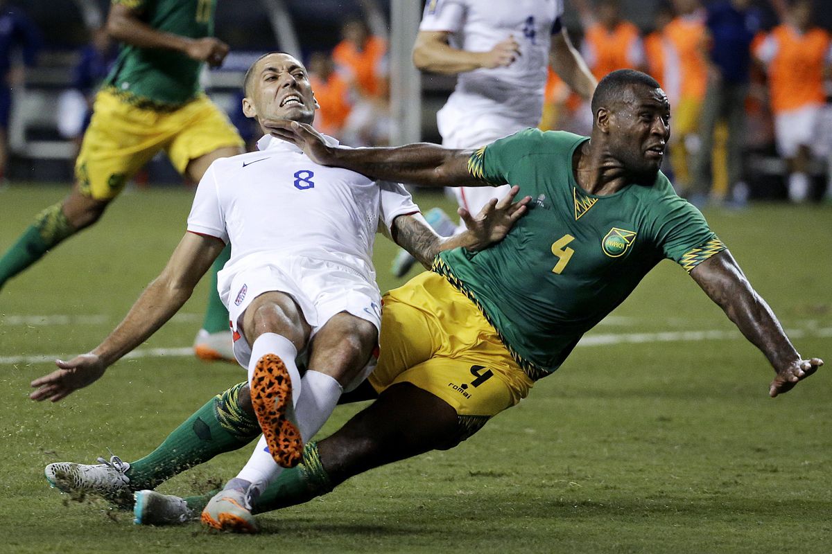 U.S. forward Clint Dempsey, left, collides with Jamaica’s Wes Morgan during the second half of Gold Cup semifinal in Atlanta. (Associated Press)