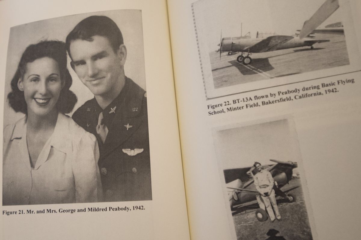 George and Mildred Peabody’s wedding photo and planes George flew during training are seen on Friday at their home in Spokane. (Tyler Tjomsland)