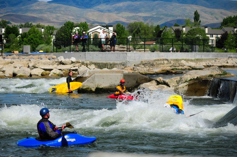 Kayakers play in Boise's whitewater park on the Boise River.  (City of Boise)