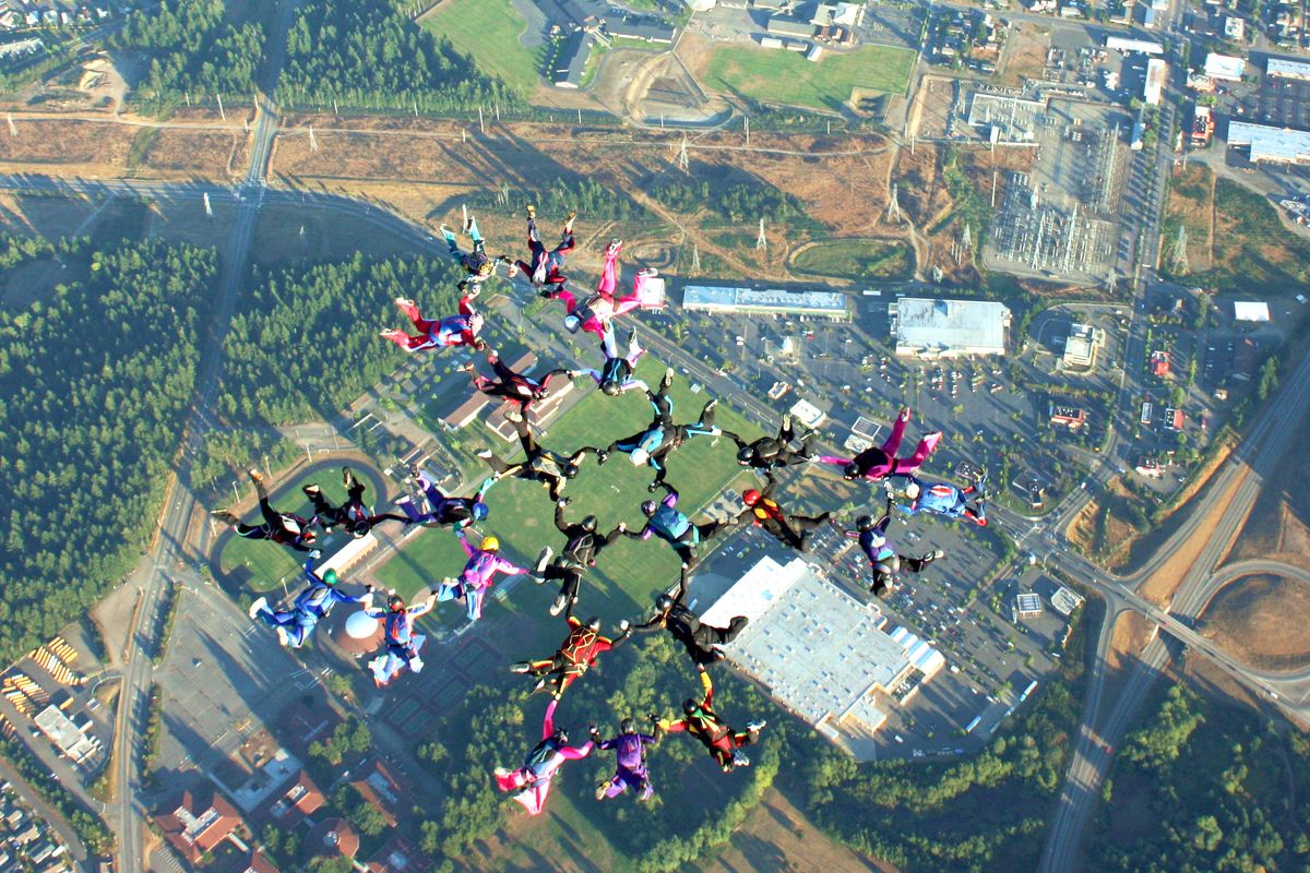 Sky divers are seen in a formation over Western Washington.