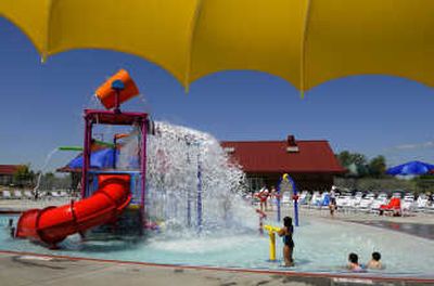 
Children play in the shallow end of the new Southside Family Aquatic Center at Prairie View Park on Saturday. 
 (CHRISTOPHER ANDERSON / The Spokesman-Review)