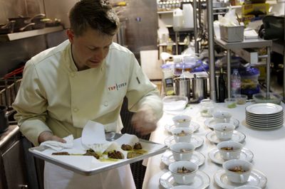 This undated photo provided by Bravo shows Richard Blais as he prepares food during “Top Chef: Finale Part 2.”  (Associated Press / The Spokesman-Review)