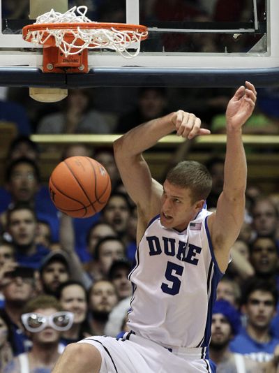 Duke’s Mason Plumlee dunks for two of his 21 points. (Associated Press)
