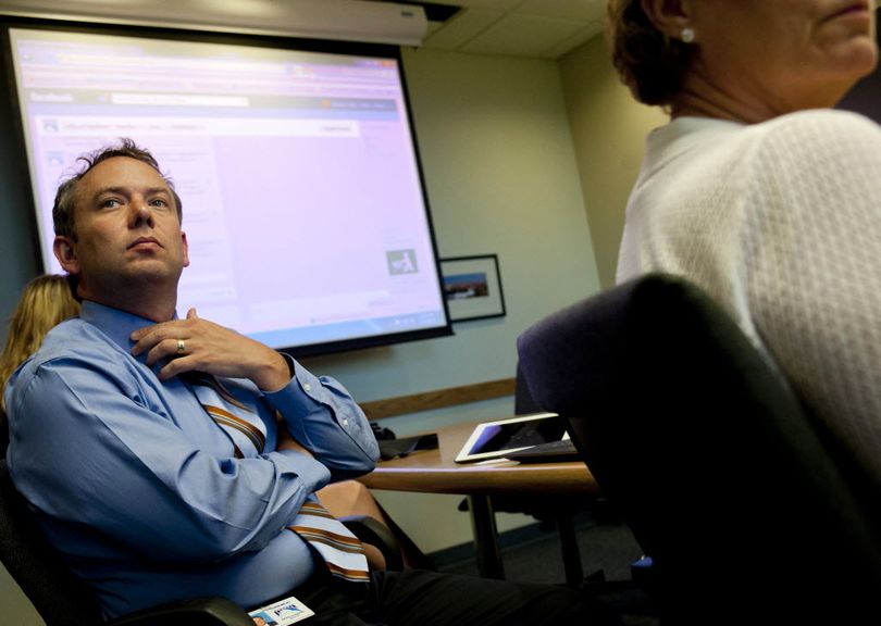 Spokane Mayor, David Condon listens to questions from the media after hosting a public Facebook chat from City Hall on Tuesday, July 17, 2012, at City Hall in Spokane, Wash. The Facebook chat aimed to reach out to voters about the 2012 budget. (Tyler Tjomsland)