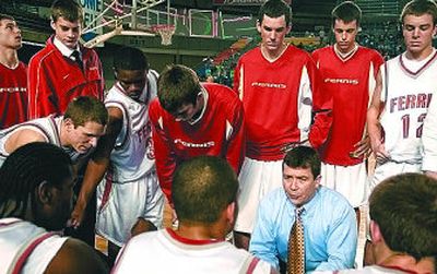 
At far right: Ferris head coach Don Van Lierop encourages his team during a fourth-quarter timeout during the Saxons' quarterfinal game against Redmond. 
 (The Spokesman-Review)