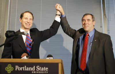 Democratic challenger Jeff Merkley, left, and Sen. Ron Wyden, D-Ore., celebrate with supporters at a news conference Thursday in Portland after Merkley beat  Republican Sen. Gordon Smith.  (Associated Press / The Spokesman-Review)