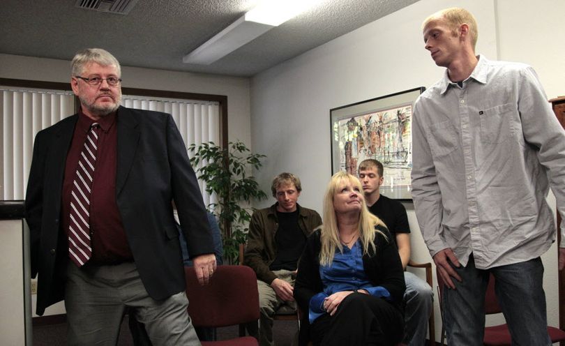  Ronald Reynolds, left, returns to his seat as his wife, Linda Reynolds, looks on and his son Jonathan Reynolds, right, steps up to speak during a news conference at an attorney's office Thursday, Nov. 10, 2011, in Olympia, Wash. Jonathan and Ronald Reynolds say they did not kill Ronda Reynolds in 1998, disputing the conclusion of an inquest jury. Ronald and Jonathan Reynolds said at the news conference that the accusations against them have been wrecking their lives. An inquest jury last month found the Reynolds men responsible for the death of Ronda Reynolds. The coroner issued arrest warrants for the two men, but the county prosecutor said there's not enough evidence to charge them criminally. (AP Photo/Elaine Thompson)

 ( (AP Photo/Elaine Thompson))