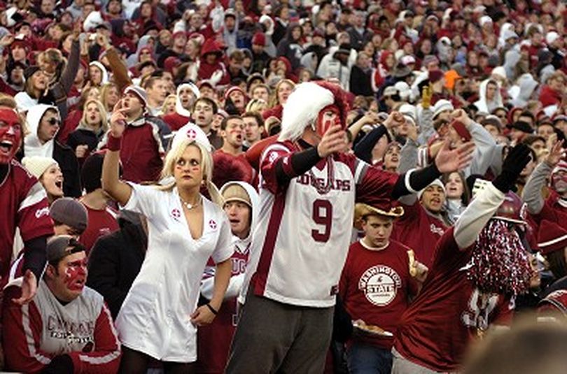 WSU fans cheer on the Cougs during the Apple Cup in Pullman Saturday November 18, 2006.  They needed first aid after dropping a 35-32 heartbreaker to the University of Washington. CHRISTOPHER ANDERSON The Spokesman-Review (Christopher Anderson / The Spokesman-Review)