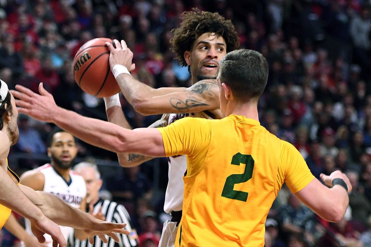 Gonzaga’s Josh Perkins looks to pass as San Francisco guard Frankie Ferrari defends during the WCC Tournament semifinal last March. (Colin Mulvany / The Spokesman-Review)