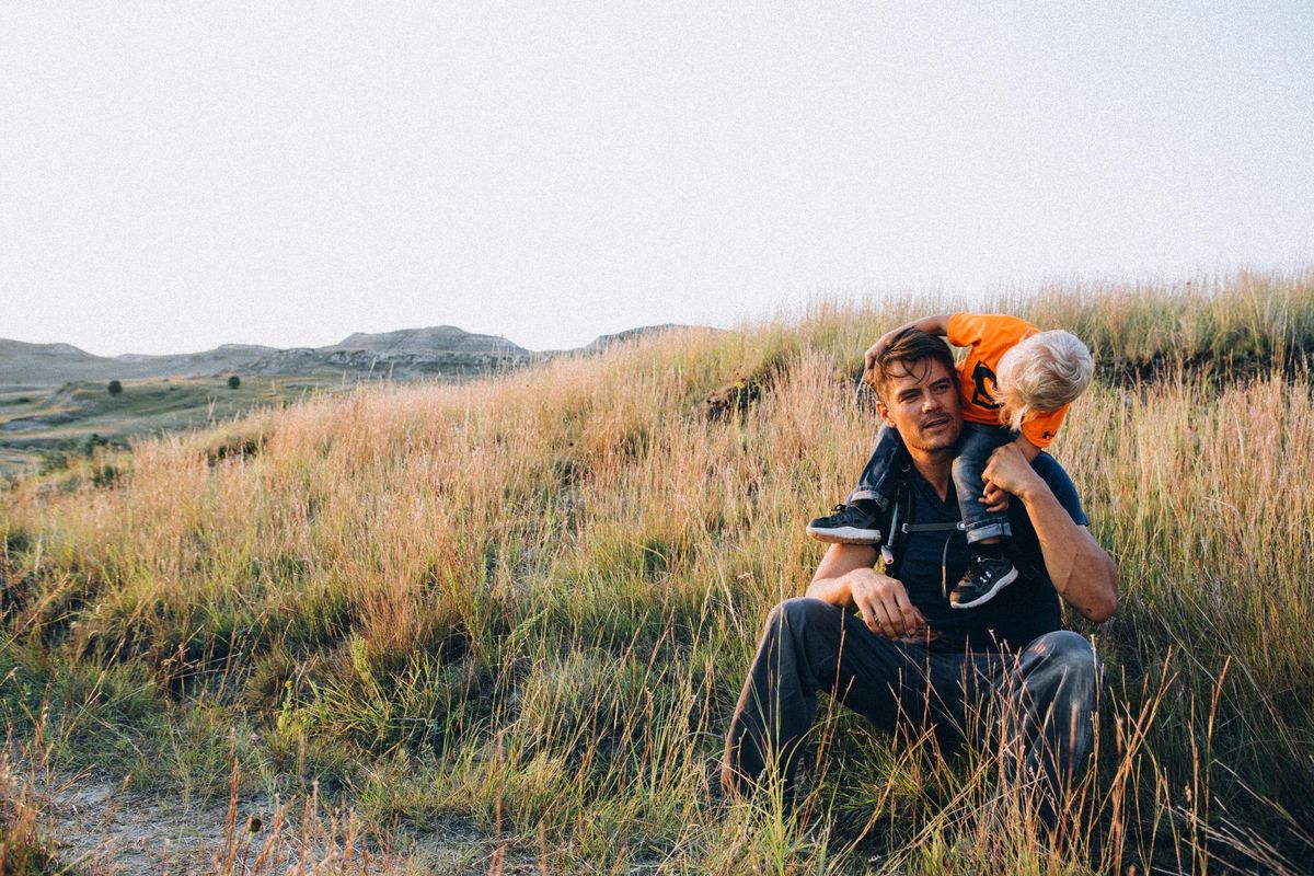 This Aug. 13, 2015, photo released by North Dakota Tourism shows actor Josh Duhamel with his toddler son Axl, in Theodore Roosevelt National Park in the Wind Canyon near Medora, N.D. Duhamel, a native of North Dakota, is serving as tourism ambassador for his home state. (Jesse Nelson / AP)