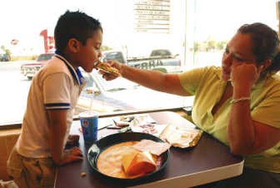 
Anayancin Llanes, 35, and her son Maximiliano, 4, eat at the recently opened Taco Bell in Apodaca in northern Mexico last week. Associated Press
 (Associated Press / The Spokesman-Review)