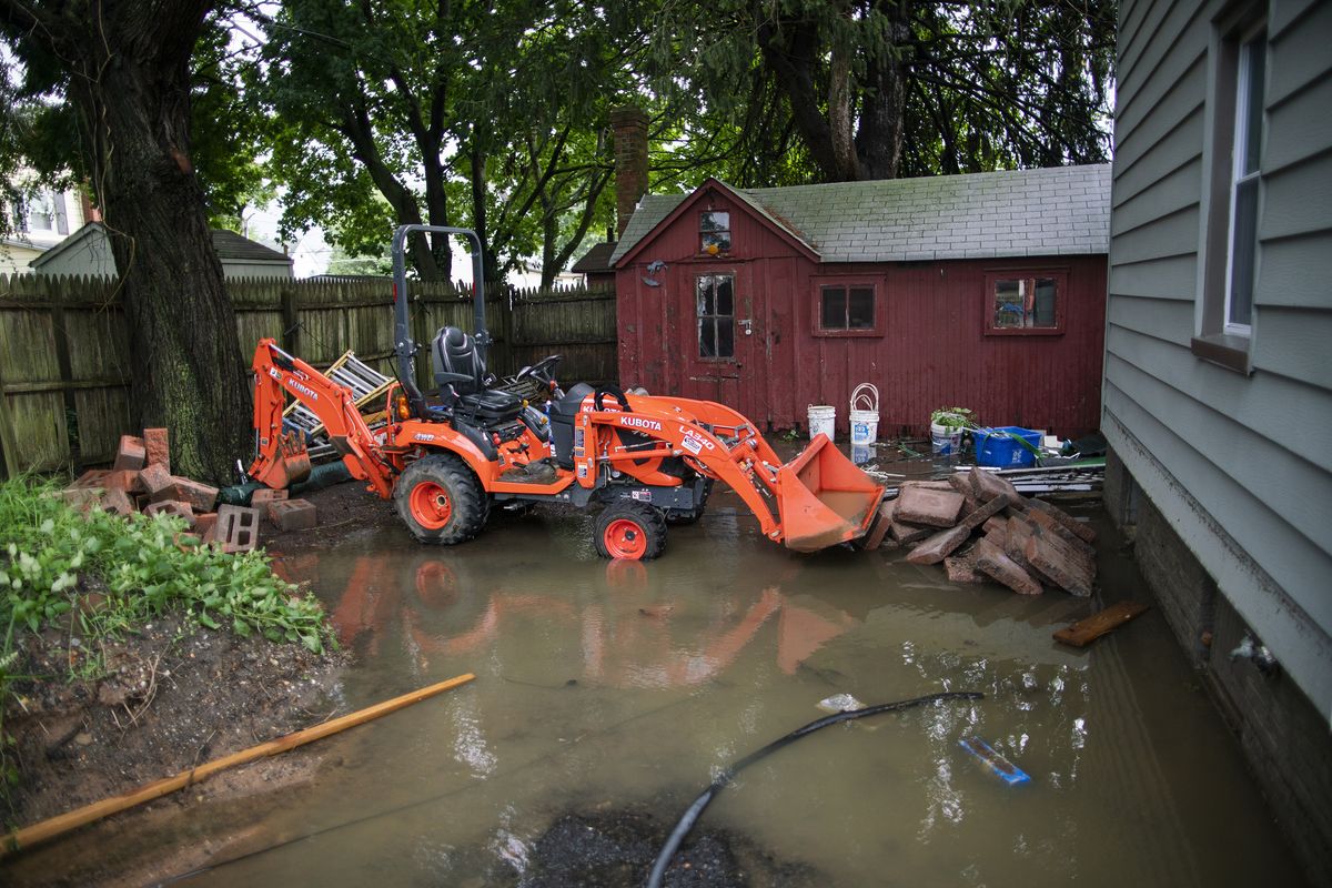 The back yard of a house is seen partially flooded during the passing of Tropical Storm Henri in Helmetta, N.J., Monday, Aug. 23, 2021.  (Eduardo Munoz Alvarez)