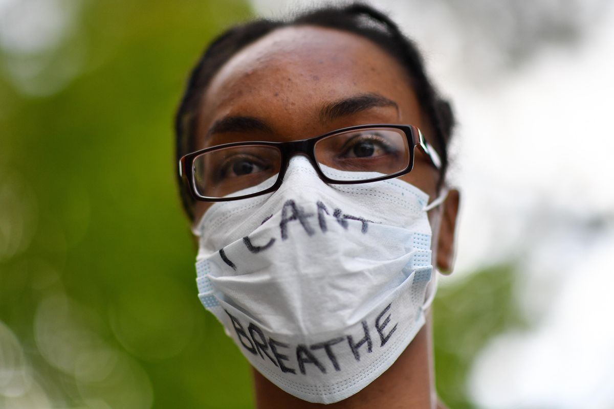 Rayanna Tensley, 26, who is getting her masters in social work at EWU, wore an “I can’t breathe” mask during a Black Lives Matter protest in front of City Hall on Monday, June 8, 2020, in Spokane, Wash. “It gives me hope that so many people are out here fighting for black lives,” she said. “I hope someday my nephew can grow up in a safe world.” Tensley added that her nephew is two. (Tyler Tjomsland / The Spokesman-Review)
