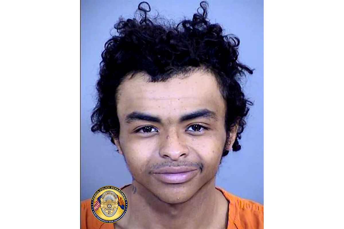 This undated photo provided by the Peoria Police Department, shows Ashin Tricarico, who is accused in a string of drive-by shootings in metropolitan Phoenix. Tricarico, 19, is accused of opening fire on vehicles and pedestrians from a white SUV in at least eight separate shootings in three cities that stoked fear throughout the region. Tricarico, who was arrested Thursday, June 17, 2021, appeared remotely for a court hearing Friday and was directed to contact a public defender.  (HOGP)