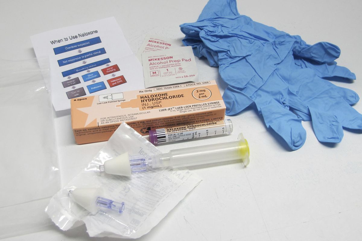 FILE - This May 13, 2015, file photo shows the contents of a drug overdose rescue kit at a training session on how to administer naloxone, which reverses the effects of heroin and prescription painkillers. (Carolyn Thompson / AP)