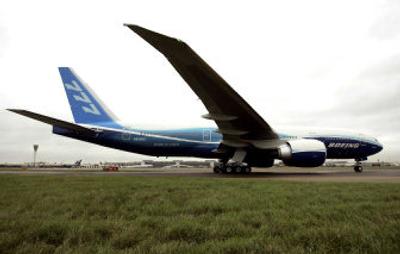 
A Boeing 777-200LR lands at Heathrow Airport on Thursday achieving its world-record, nonstop flight from Hong Kong to London. 
 (Associated Press / The Spokesman-Review)