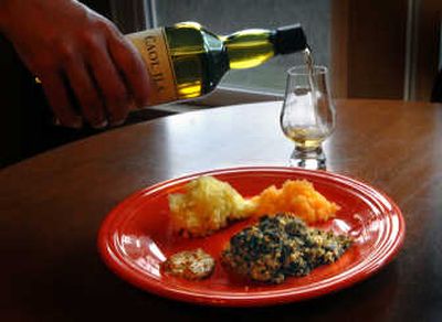 
Nothing goes better with a plate of oven-baked haggis – a Scottish tradition – than a good glass of Scotch. 
 (Photos by Brian Plonka / The Spokesman-Review)