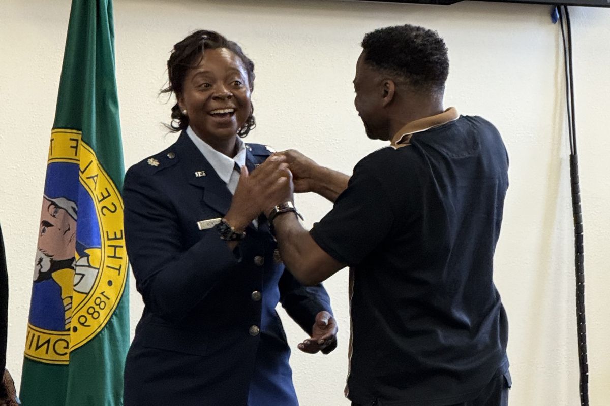 Ret. Lt. Col. Tanisha K. Morton celebrates with family in a retirement pinning tradition. 