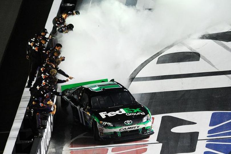 Denny Hamlin, driver of the #11 FedEx Ground Toyota, celebrates with a burnout after winning the NASCAR Sprint Cup Series IRWIN Tools Night Race at Bristol Motor Speedway on August 25, 2012, in Bristol, Tenn. (Credit: Jared C. Tilton/Getty Images) (Jared Tilton / Getty Images North America)