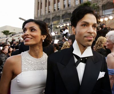 In this Feb. 27, 2005 file photo, singer Prince arrives with his wife Manuela Testolini for the 77th Academy Awards in Los Angeles. Andra Day, Dave Stewart of the Eurythmics and Philip Bailey of Earth, Wind & Fire will perform during a fundraising gala honoring Prince to benefit the foundation of his second wife, Testolini. The evening Sunday to raise money for In a Perfect World will be hosted by Anthony Anderson. Bobby Brown, Beyonces mother, Tina Knowles, Chaka Khan and Princes Purple Rain co-star Apollonia Kotero were scheduled to attend. Testolini, who was married to the late megastar from 2001 to 2007, told The Associated Press on Friday that performances will be heavy on Prince music. About 250 people will attend in Los Angeles. (KEVORK DJANSEZIAN / Associated Press)