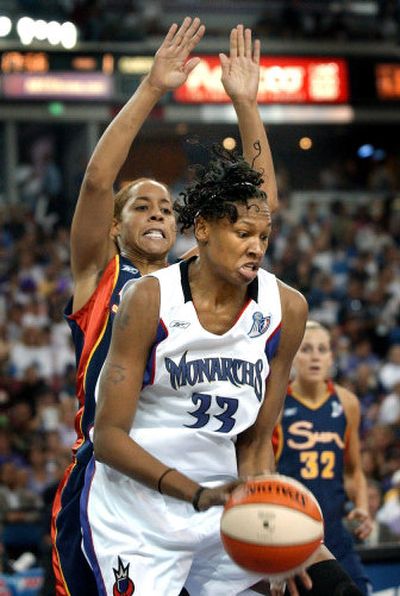 
Yolanda Griffith (33) works against the Sun's Nykesha Sales on her way to 14 points and 10 rebounds. 
 (Associated Press / The Spokesman-Review)
