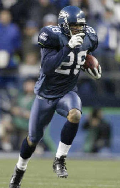 
Seattle Seahawks' Michael Boulware runs back an interception for a 63-yard touchdown return against Miami. 
 (Associated Press / The Spokesman-Review)
