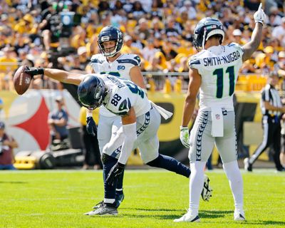 Tight end AJ Barner spikes the ball in the end zone after scoring on a 7-yard touchdown catch during the Seahawks’ victory over the Steelers on Sunday at Acrisure Stadium in Pittsburgh.  (Jennifer Buchanan/Seattle Times)