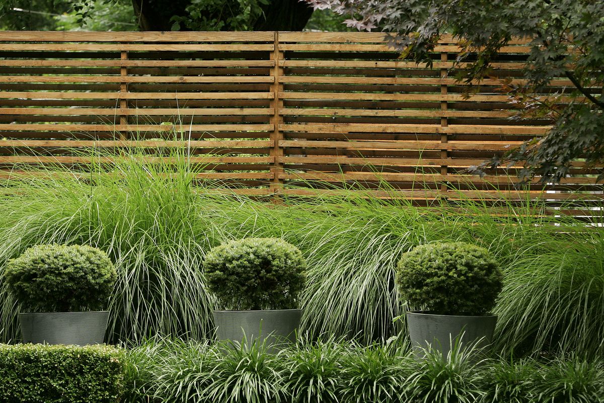 A wood fence designed and built by interior designer Amy Funk, of Prairie Village, Kan. When choosing fencing, consider the age and style of your home. 