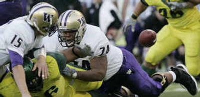 
Washington's loss to Oregon Saturday pushes questions as to the future of the Huskies coaching staff. 
 (Associated Press / The Spokesman-Review)