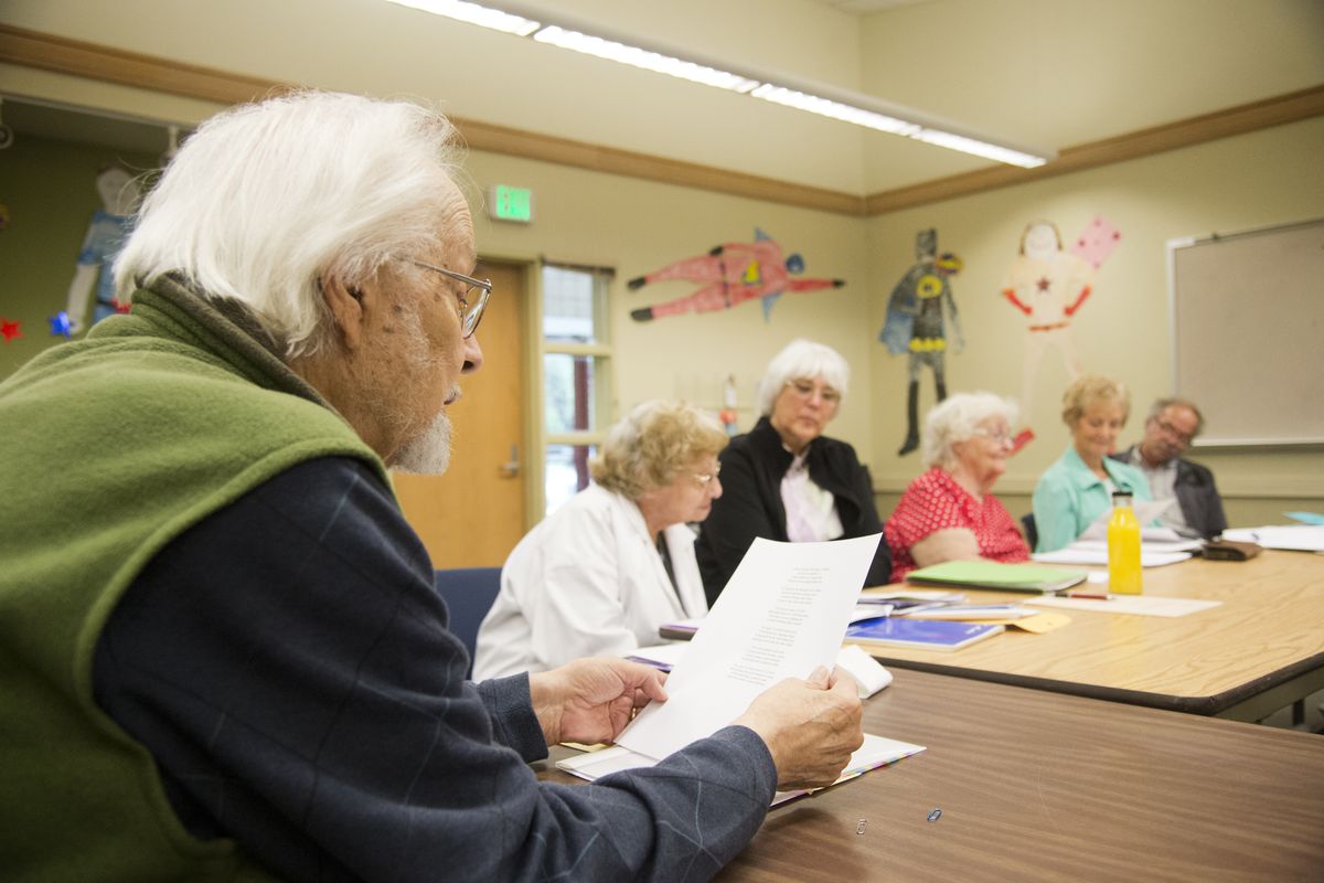 James Vasquez, left, reads one of his long-form poems for the Poetry Scribes of Spokane on Sept. 2 at the North Spokane County Library. The group meets once a month to share new work, get critiqued and get prompts for future work. (Jesse Tinsley)