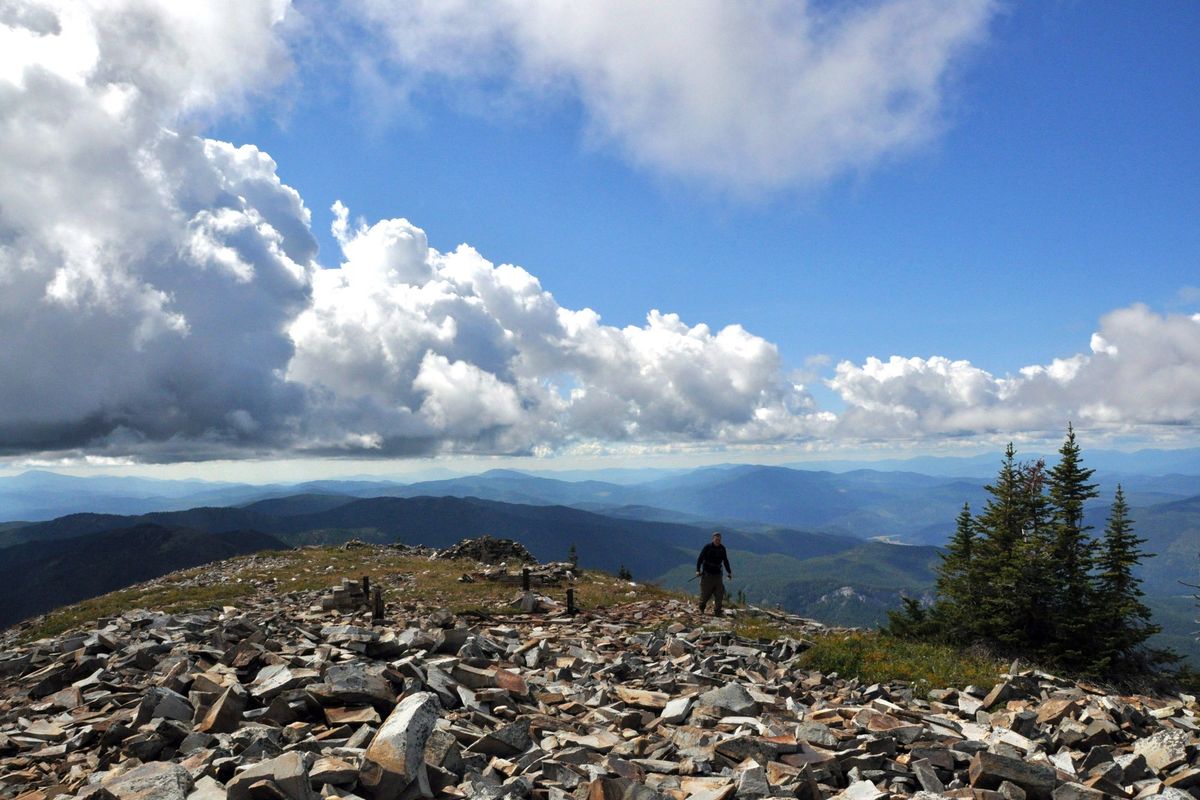 A hiker reaches the summit of Abercrombie Mountain, a 7,308 peak overlooking the Pend Oreille River near Ione, Washington, in this 2011 file photo. Abercrombie is in an inventoried roadless area.  (RICH LANDERS/The Spokesman-Review)