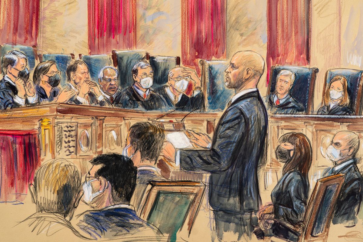 This artist sketch depicts lawyer Scott Keller standing to argue on behalf of more than two dozen business groups seeking an immediate order from the Supreme Court to halt a Biden administration order to impose a vaccine-or-testing requirement during the COVID-19 pandemic, Jan. 7 in Washington.  (Dana Verkouteren)