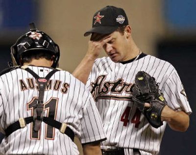 
Houston Astros catcher Brad Ausmus visits with starter Roy Oswalt during the Chicago White Sox's five-run fifth inning in Tuesday's World Series Game 3. 
 (Associated Press / The Spokesman-Review)