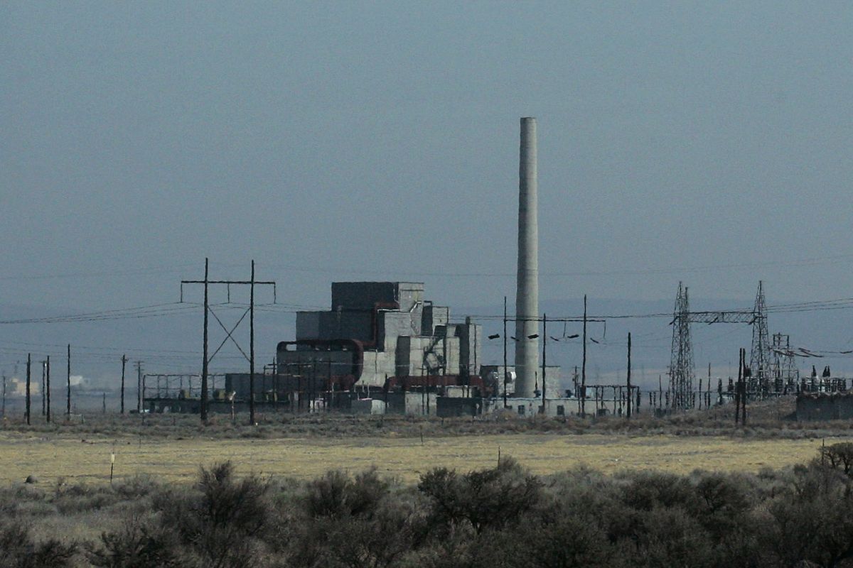 FILE - The decommissioned plutonium-producing B reactor is shown on the Hanford Nuclear Reservation, April 3, 2008, as viewed from a bus taking visitors on a public tour near Richland, Wash. The federal government is moving forward with the cost-saving "cocooning" of eight plutonium production reactors at Hanford that will place them in a state of long-term storage for decades to allow radiation inside to dissipate until they can be dismantled and buried.  (Ted S. Warren)