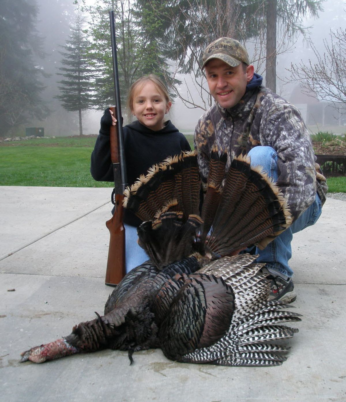 Ally Jones, 8, of Newport poses with her first wild turkey, which she bagged in May, 2011, with her father, Chris Jones, shortly after completing her hunter education course in April. (Courtesy photo)