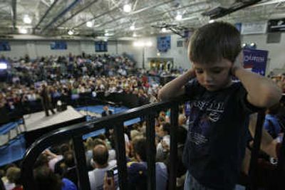 
Gabriel Shaffer-Merriman, 5, covers his ears from the loudspeakers as Sen. Hillary Rodham Clinton campaigns  at a high school in Johnstown, Pa.. Associated Press
 (Associated Press / The Spokesman-Review)