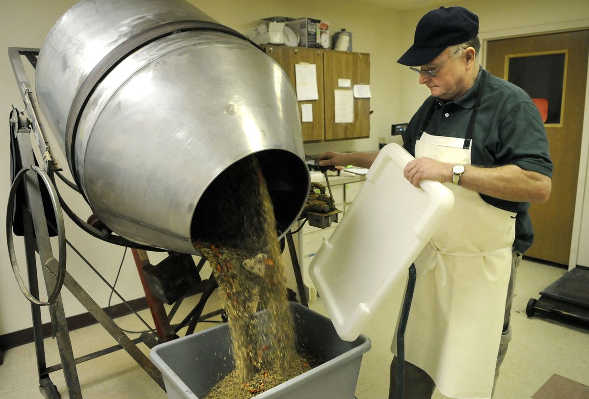 Don Vannoy, of The Michlitch Co. in Spokane, empties the mixer after preparing a batch of pickling spice.danp@spokesman.com (Dan Pelle / The Spokesman-Review)
