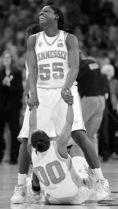 Tennessee's Nicky Anosike (55) and teammate Shannon Bobbitt celebrate their victory.
(Associated Press / The Spokesman-Review)