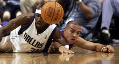 
Dallas' Jason Terry, left, fights on the floor for a loose ball with Detroit's Carlos Arroyo during the first half of Thursday's preseason game. Both teams will be contenders this season. 
 (Associated Press / The Spokesman-Review)