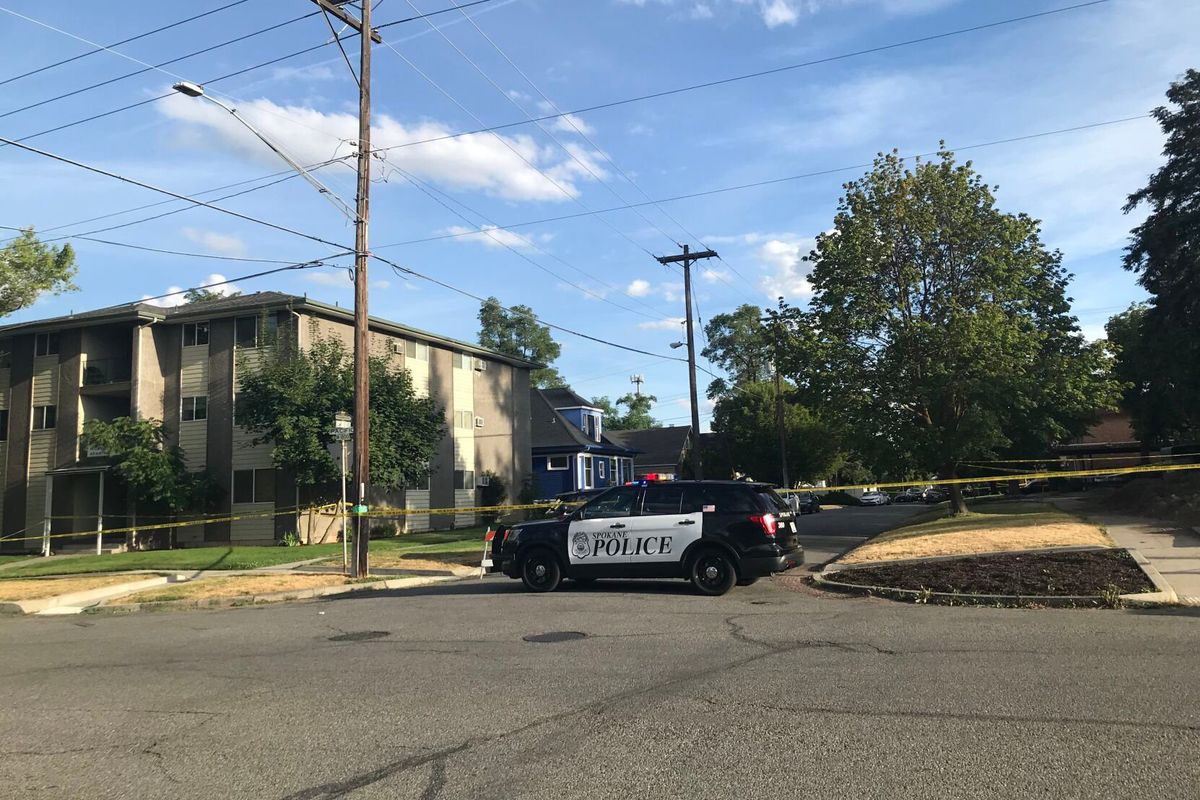 Spokane police cordoned off several blocks of the Browne’s Addition neighborhood on Aug. 8, 2020, following reports of a woman found dead in a vehicle. Detectives later arrested 37-year-old Nathan A. Beal on suspicion of second-degree murder.  (Ted McDermott / The Spokesman-Review)