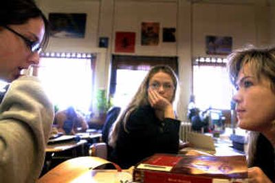 
Ellen Gillespie, right, talks with Amber Morten, 15, during freshman English on Monday while Tayla Root, 15, listens in the background. Gillespie just earned national board certification that awards her the highest standards a teacher can acheive. 
 (Jed Conklin / The Spokesman-Review)