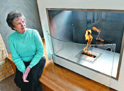 
Nadine Sullivan of Eco Depot offers a EcoSmart Fire in her east Sprague store. The fireplace is enviromentally friendly, flue-less and requires no installation or utility connection for fuel supply. It burns denatured ethanol. 
 (DAN PELLE/the spokesman-review / The Spokesman-Review)
