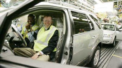 
Alan Mulally, President and CEO of Ford Motor Company, right, and Anthony Hoskins, plant manager, Chicago Assembly Plant, sit in a 2008 Ford Taurus X on the assembly line in this June 22 file photo after a launch celebration for the 2008 Ford Taurus, Taurus X, and Mercury Sable at the Chicago Assembly Plant. Associated Press
 (Associated Press / The Spokesman-Review)
